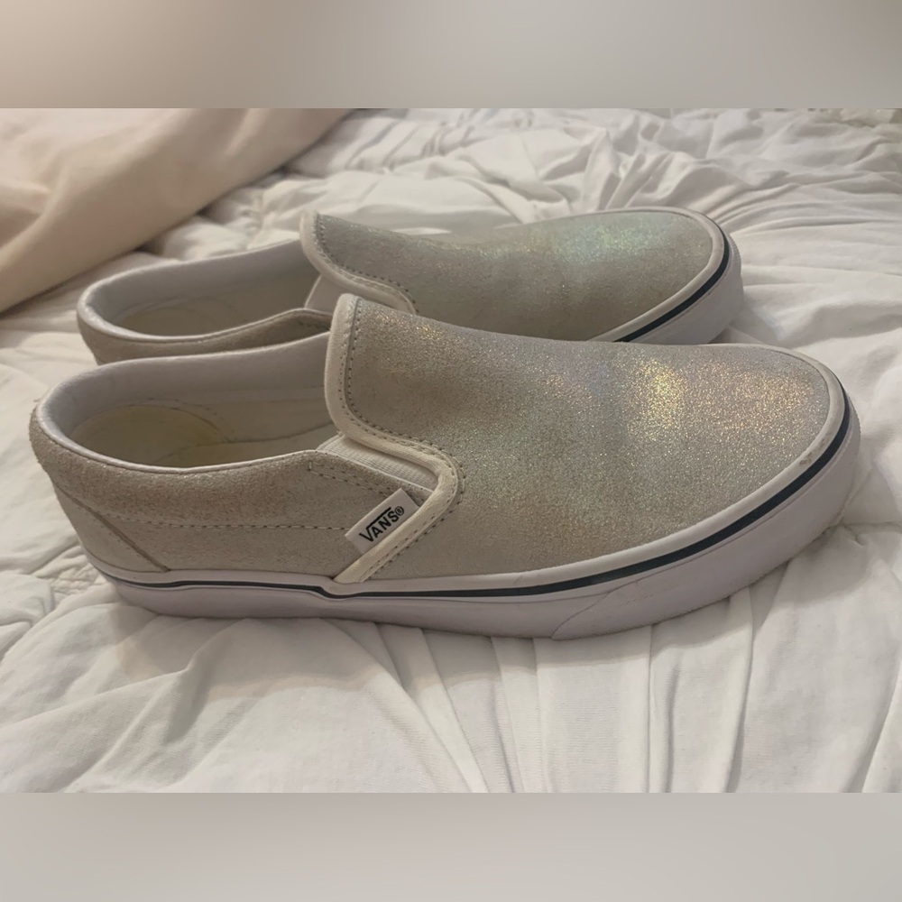 Silver, metallic glittery slip on Vans. Unisex, 8 women’s, 6.5 men’s.